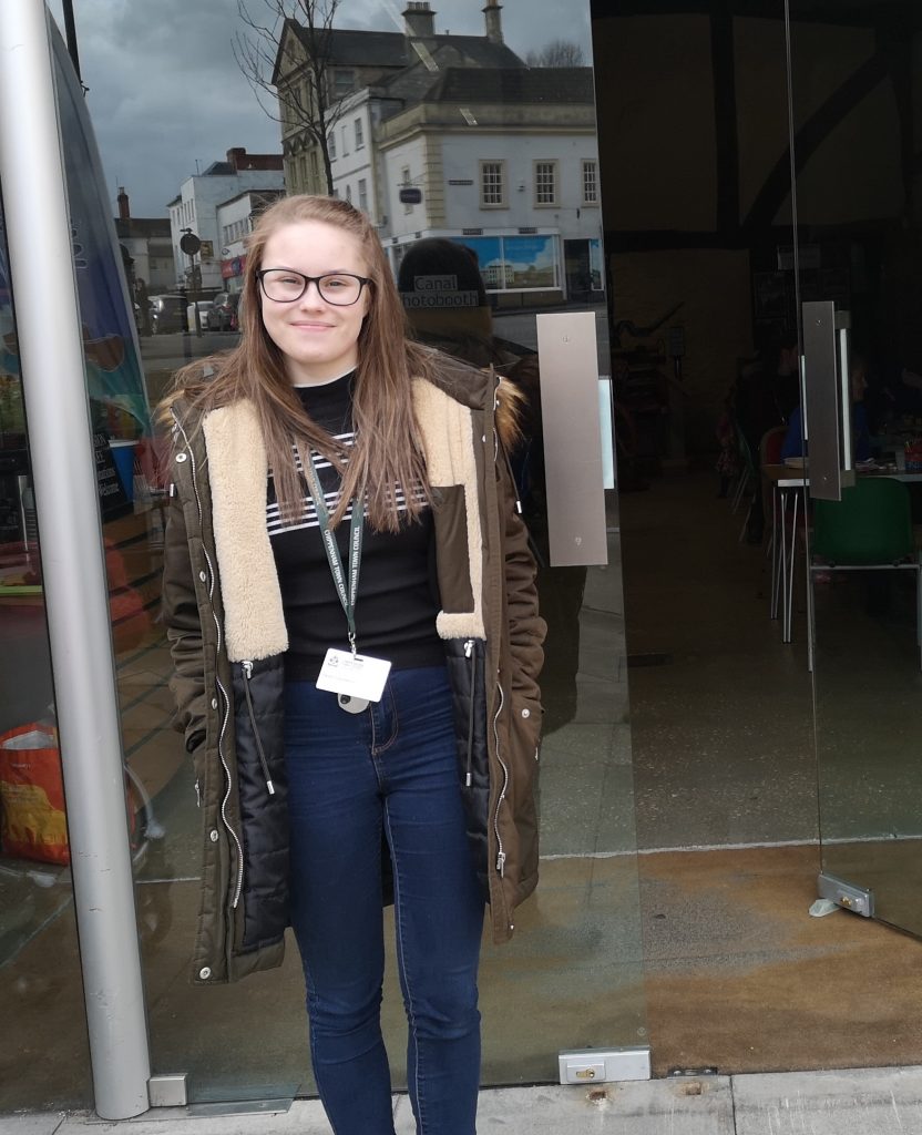 Millie, standing outside Yelde Hall