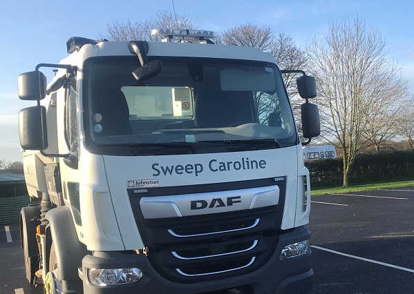 Sweep Caroline 1 A white road sweeper parked on tarmac with the words 'Sweep Caroline' printed on the front.