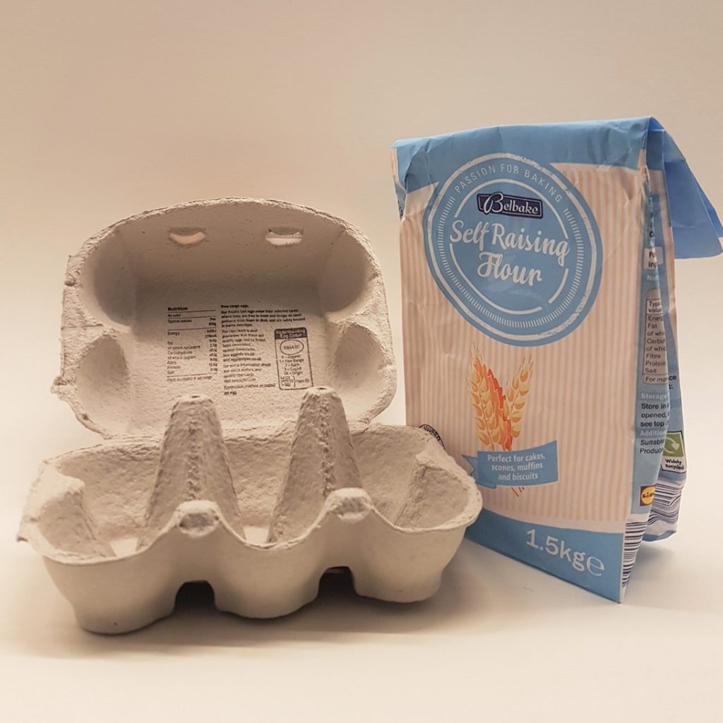 empty egg box and bag of flour