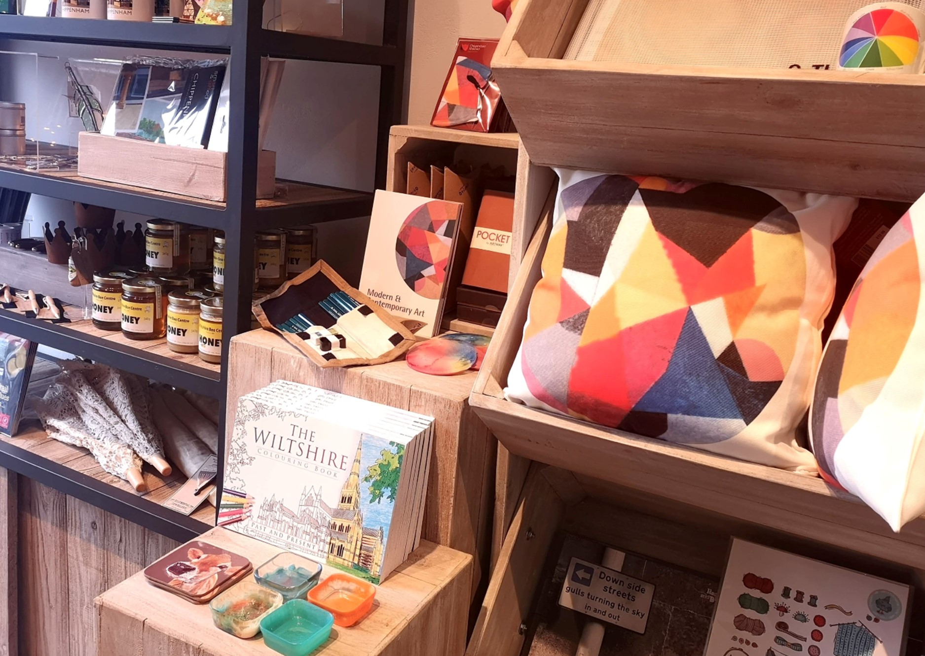 shop display with books, cushions, and more products