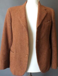 Tan woollen suit jacket on a mannequin