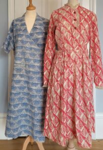 two dresses on a mannequins, one blue and one red