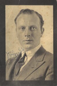 signed photograph of a head and shoulders portrait of a man