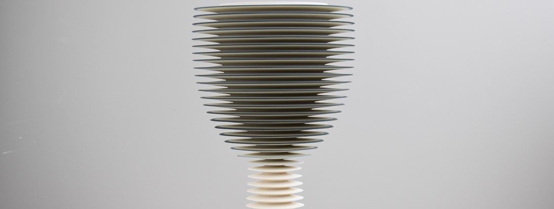 Spotlight 3 banner A photograph of a grey and white, goblet shaped, tiered vase