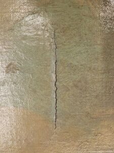 Tear in painting