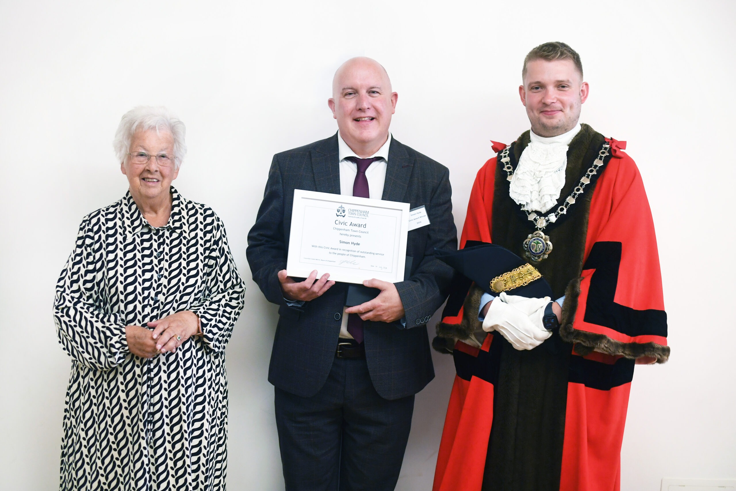 Simon Hyde Civic Award 2024 Photograph of 3 people including the mayor and someone winning a civic award