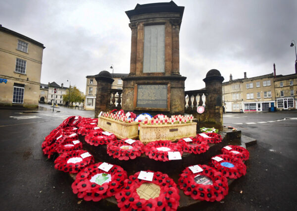 Memorial Photograph of the Chippenham memorial with red poppy wreaths surrounding it