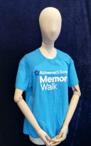 Mannequin wearing a blue t shirt printed with "Alzheimer's Society Memory Walk".