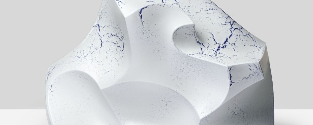 Chippenham Museum Detail of ceramic sculpture with smooth white surface with blue flecks