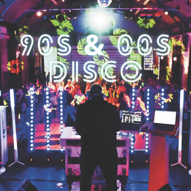 90s and 00s Disco Night. DJ and stage lights.