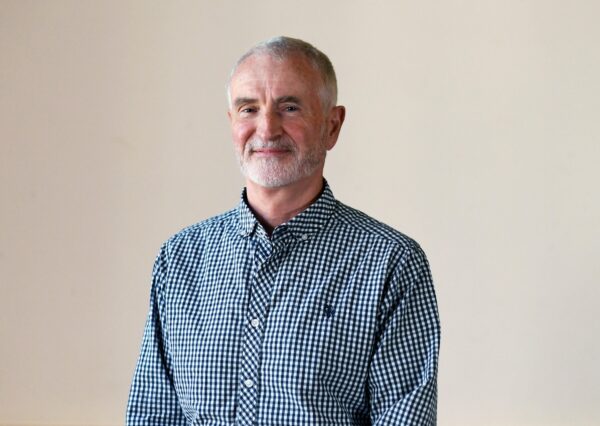 Councillor Nick Murry wearing a blue and white checked shirt